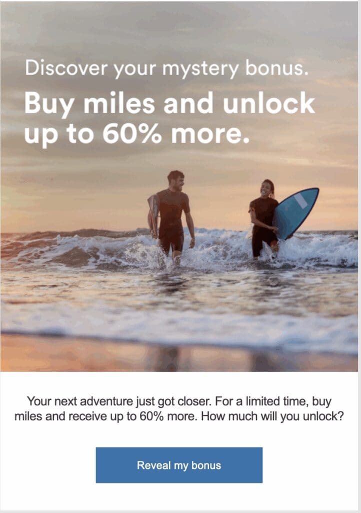 a man and woman walking in the water with surfboard