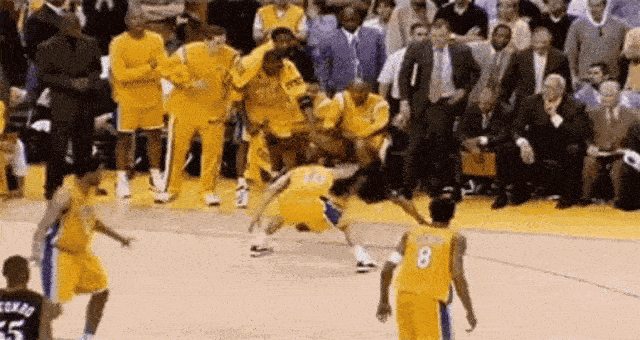 a basketball player falling off the ground