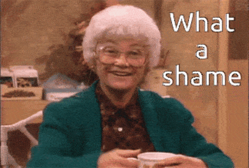 a woman with white hair and a cup