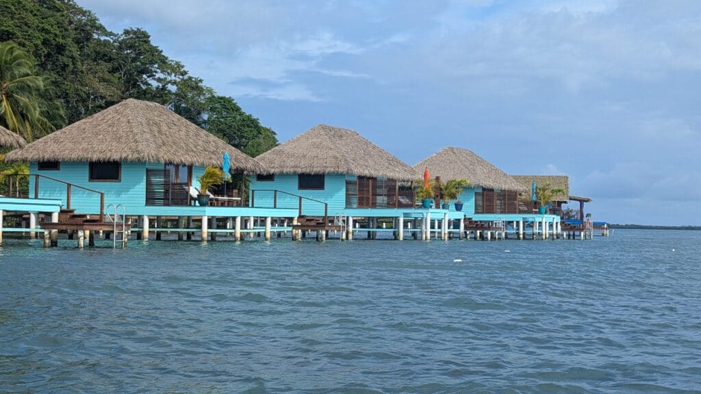 a row of houses on stilts on water