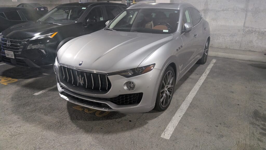 a silver car parked in a parking lot