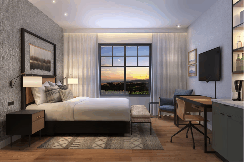 a bedroom with a desk and a bed