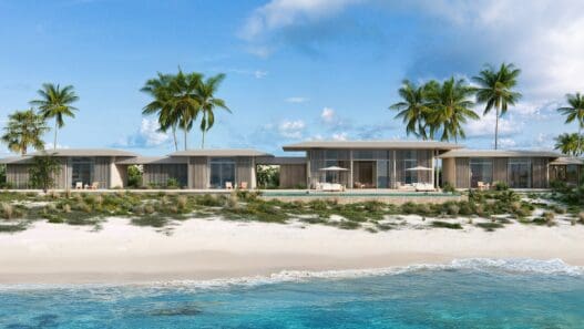 a beach house with palm trees