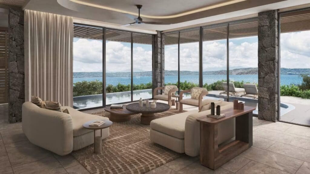 a living room with a view of the ocean