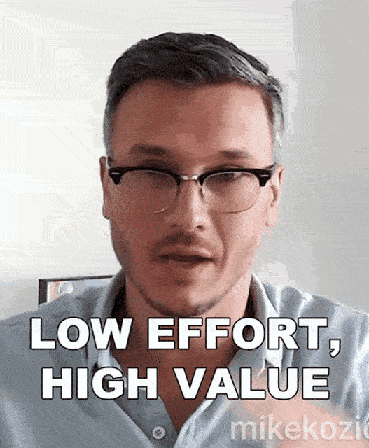 a man wearing glasses and a blue shirt