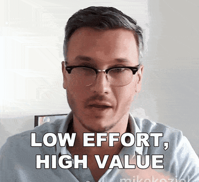 a man wearing glasses and a blue shirt