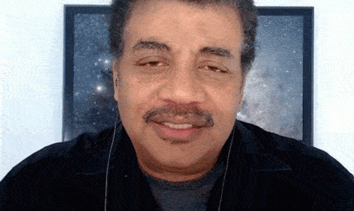 a man with a mustache and earphones
