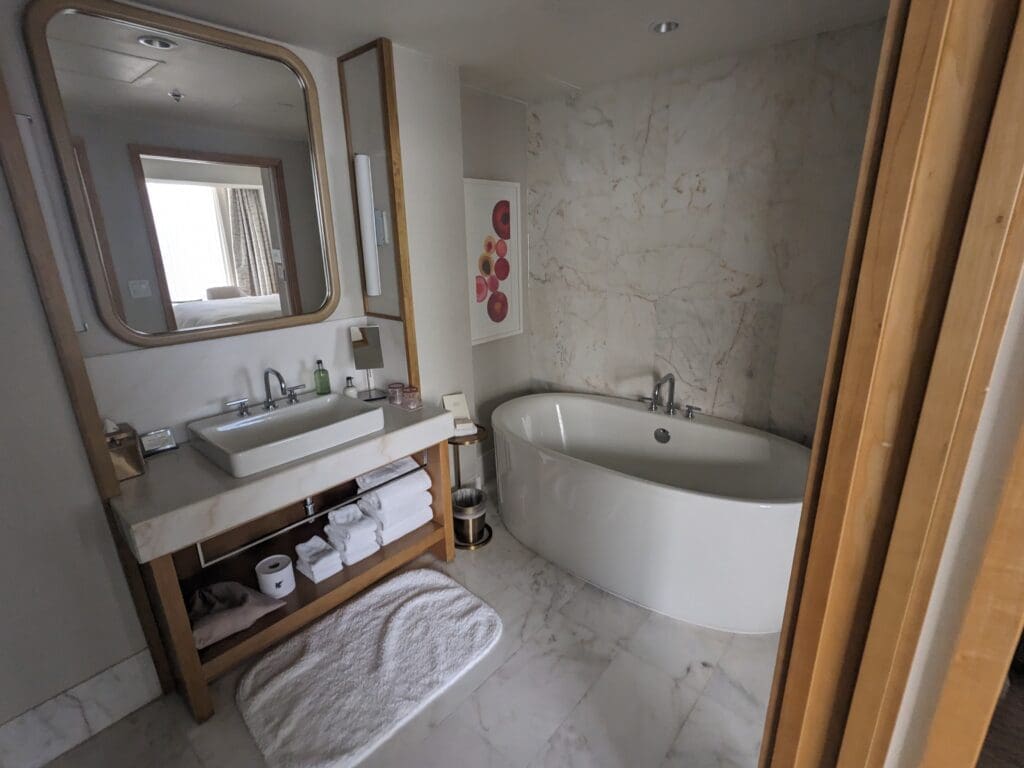 a bathroom with a tub and sink