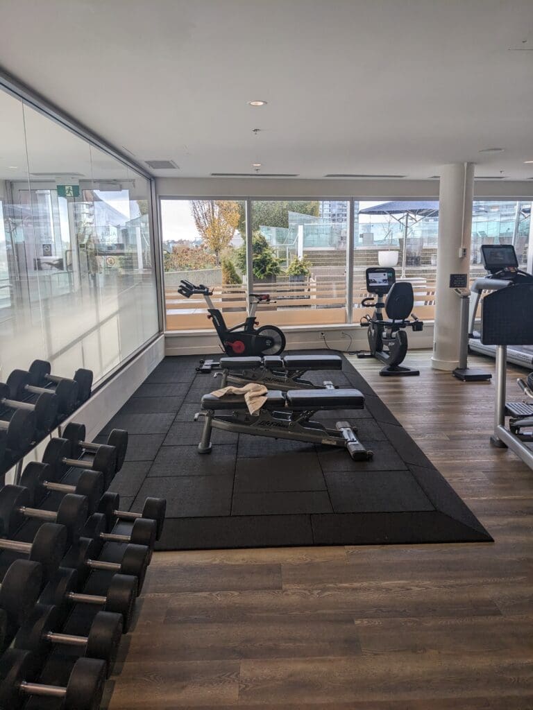 a room with exercise equipment and exercise bikes