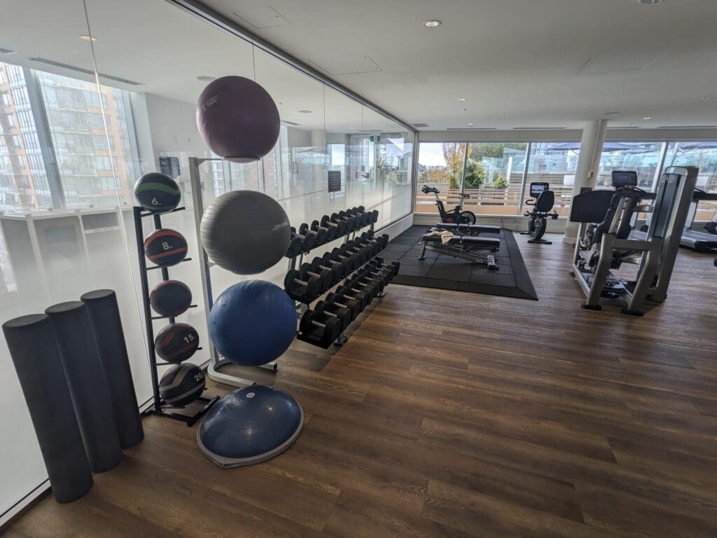 a room with exercise equipment and a bike