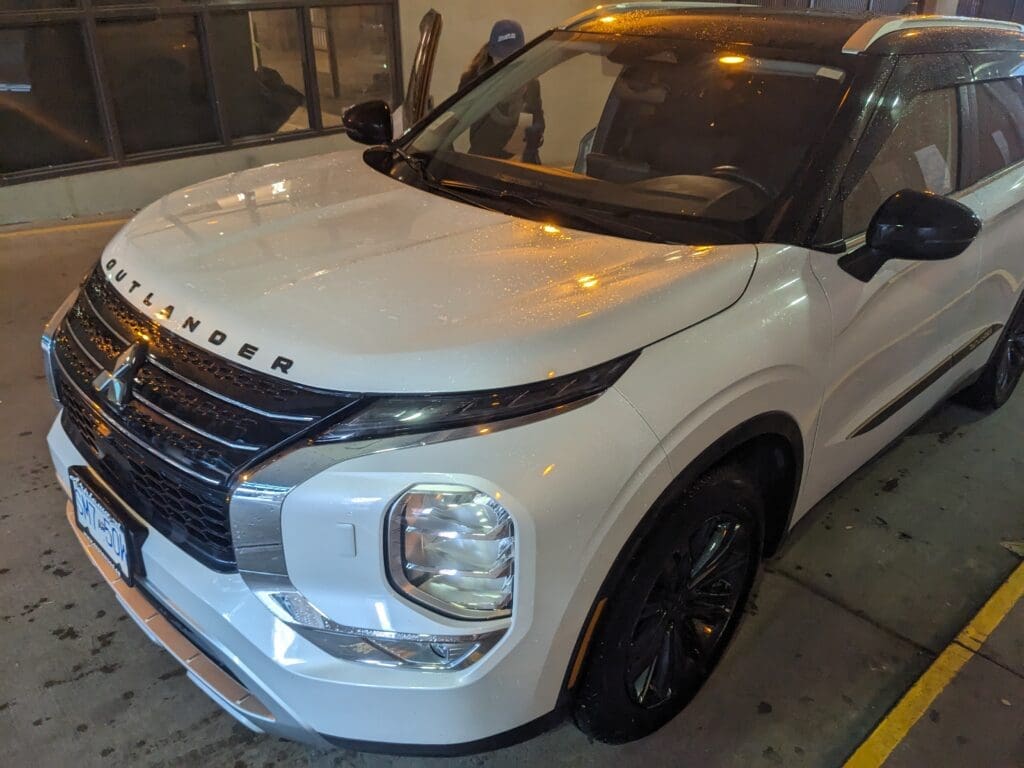 a white car parked in a parking lot
