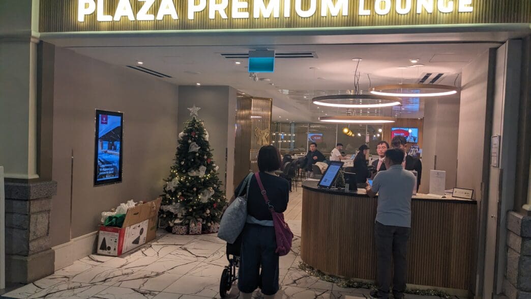a group of people standing in front of a lobby