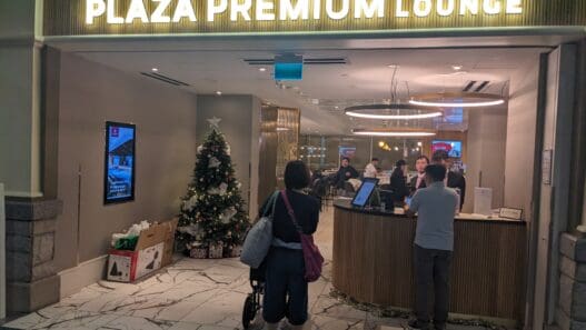 a group of people standing in front of a lobby