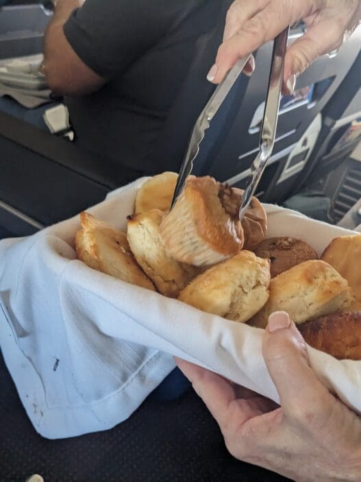 a person holding a basket of food