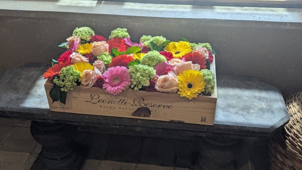 a box of flowers on a window sill