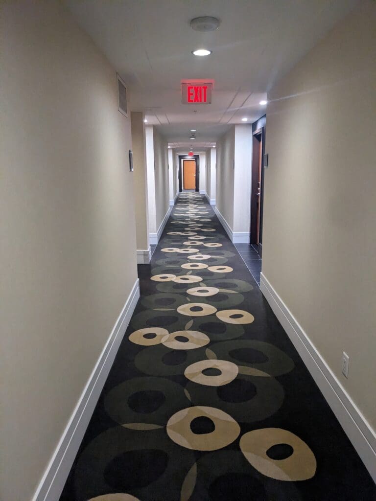a hallway with a carpeted floor
