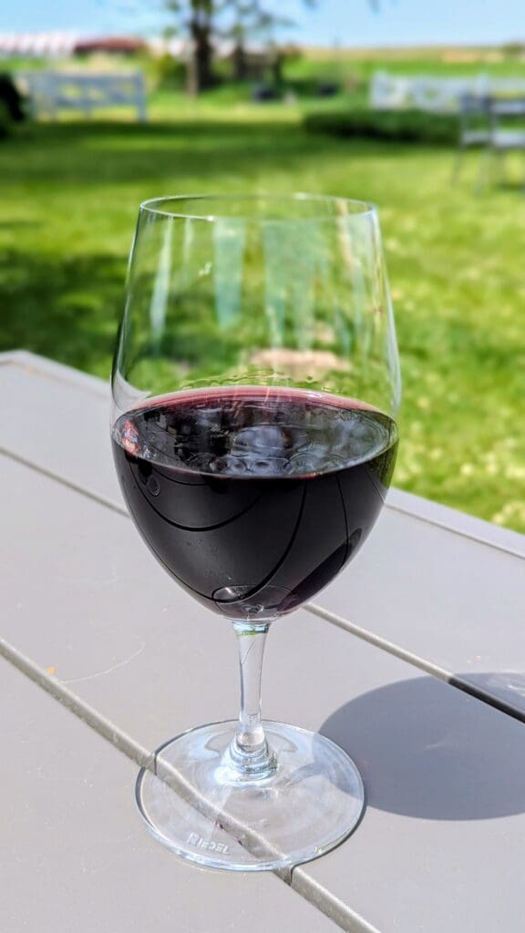 a glass of wine on a table