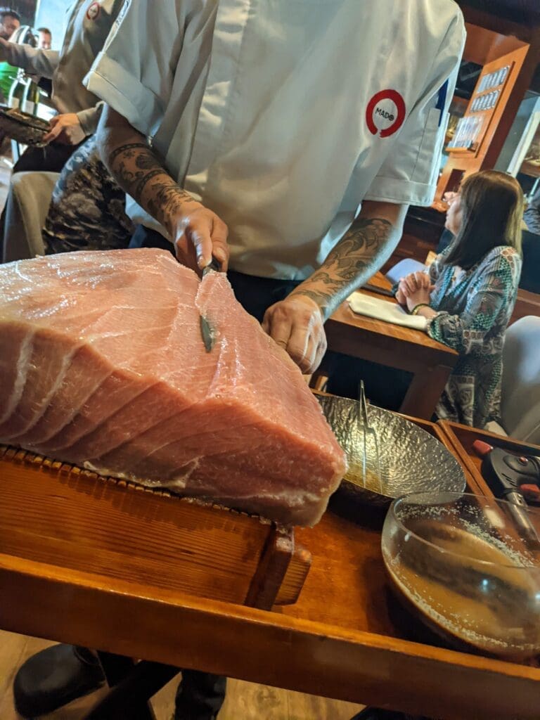 a man cutting a piece of meat