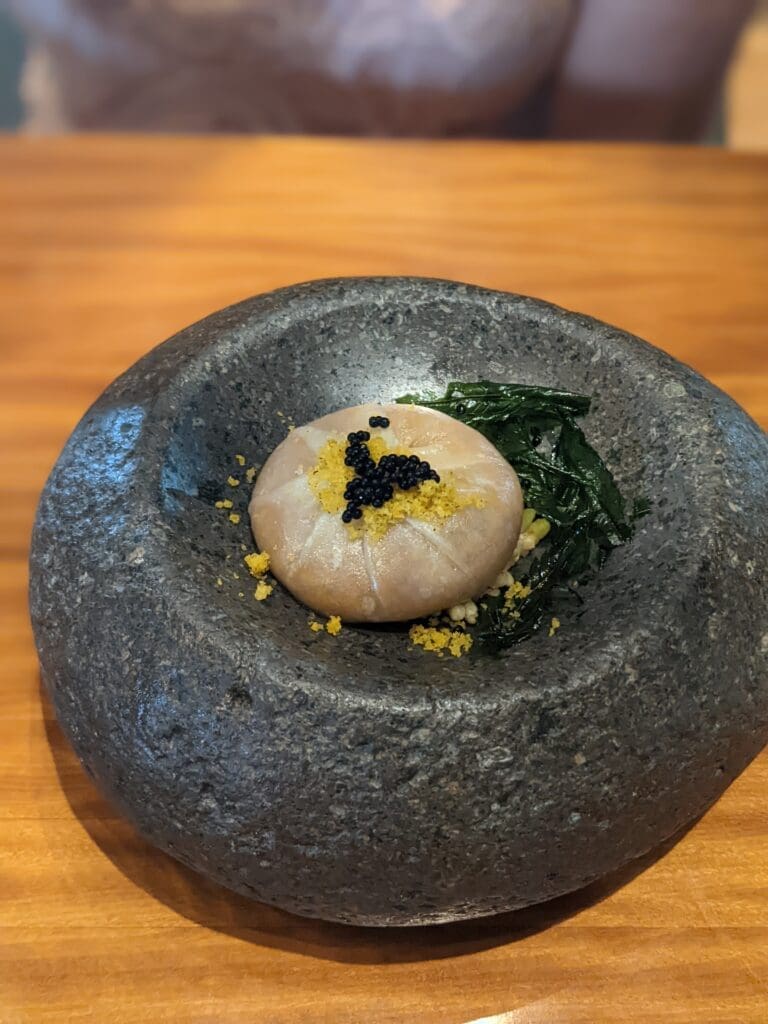a stone bowl with food on it