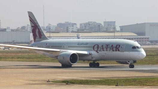 a large white airplane on a runway