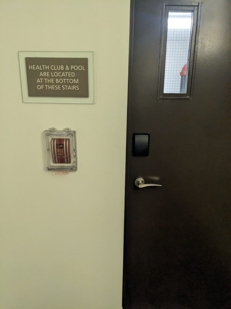 a door with a sign on the wall