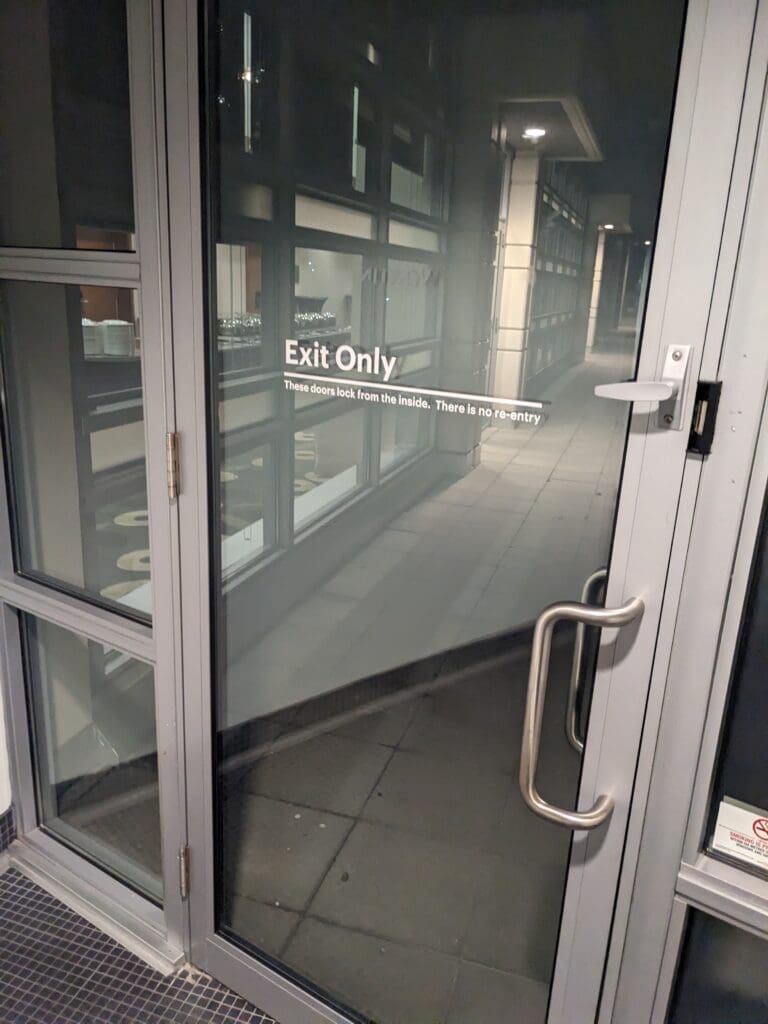 a glass door with a sign on it