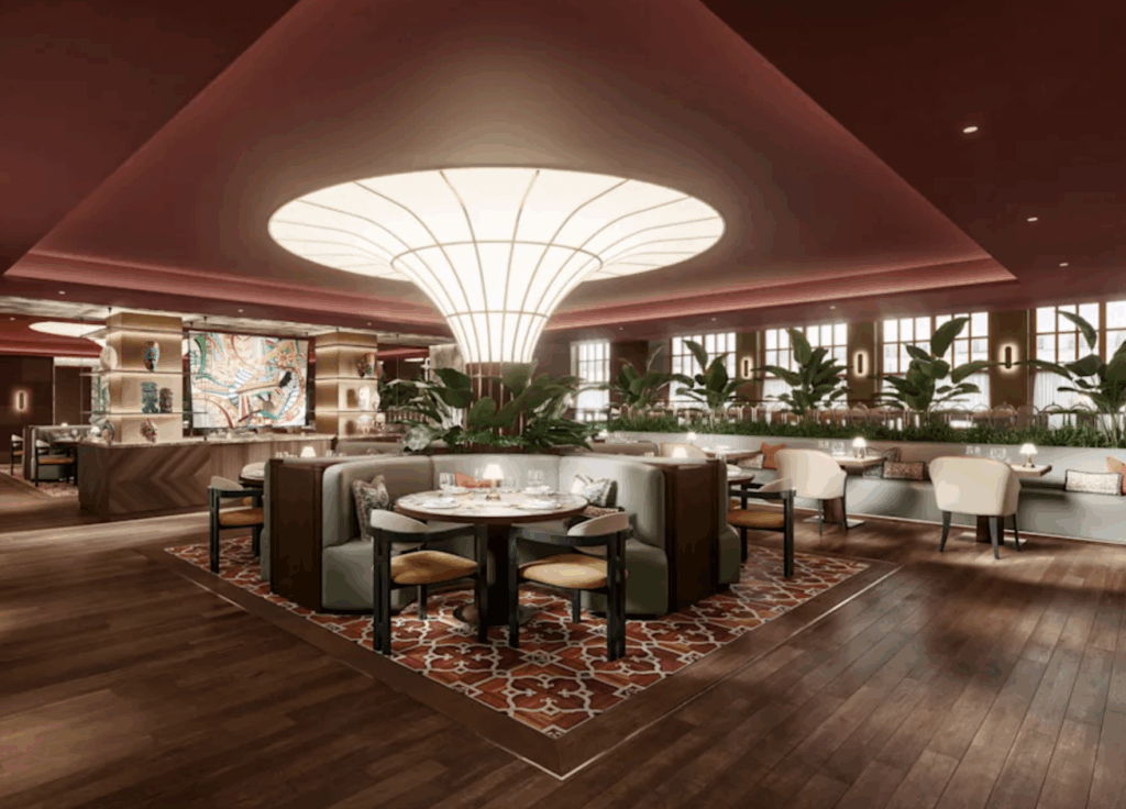 a room with a large chandelier and tables