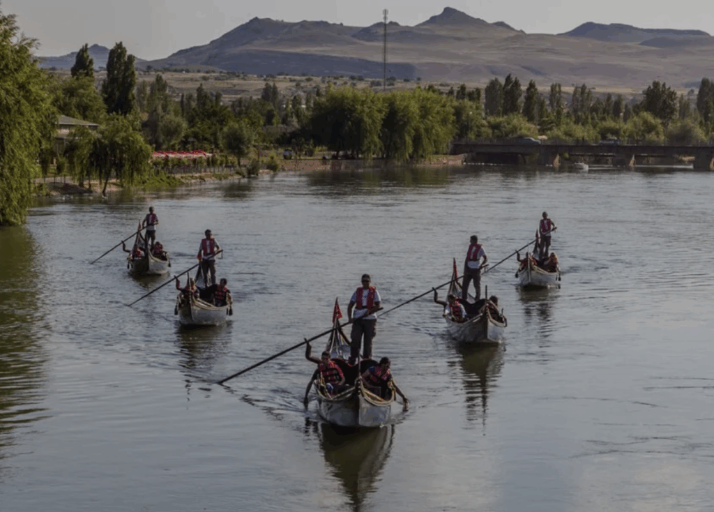 a group of people rowing boats on a river