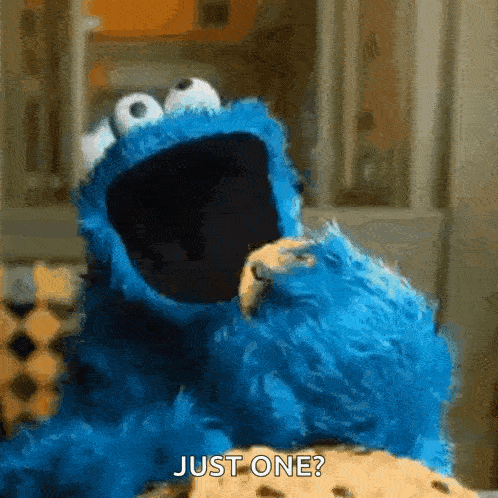 a blue puppet with mouth open