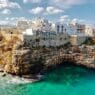 a building on a cliff above water
