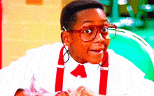 a man wearing red glasses