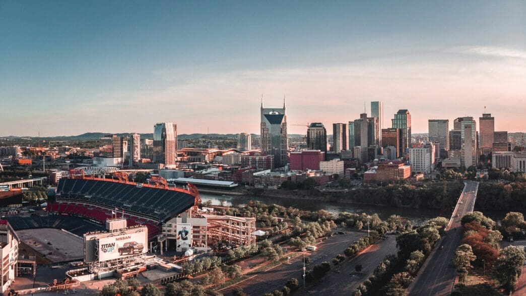 a city with a stadium and a river