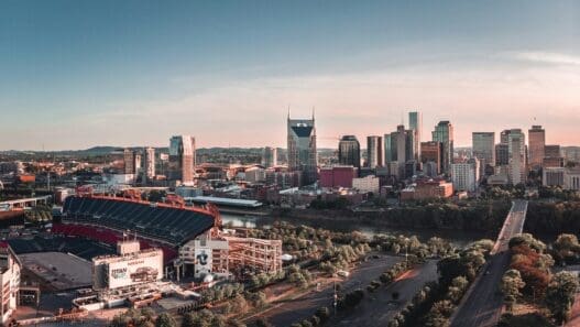 a city with a stadium and a river
