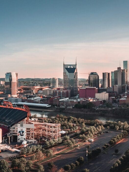 a city with a stadium and a river