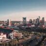 a city with a stadium and a river