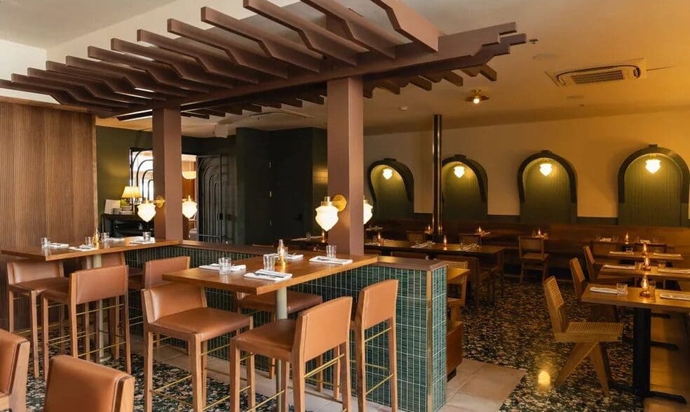 a restaurant with tables and chairs at Bar Luca from Found Hotels