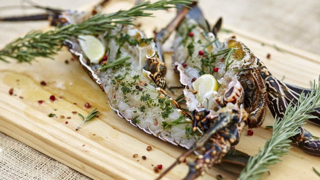 a lobster tails on a wooden board