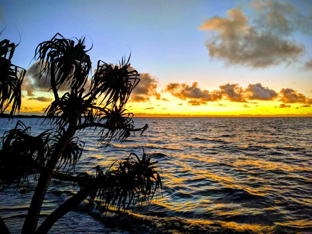 a sunset over a body of water in the Yasawa Islands, Fiji