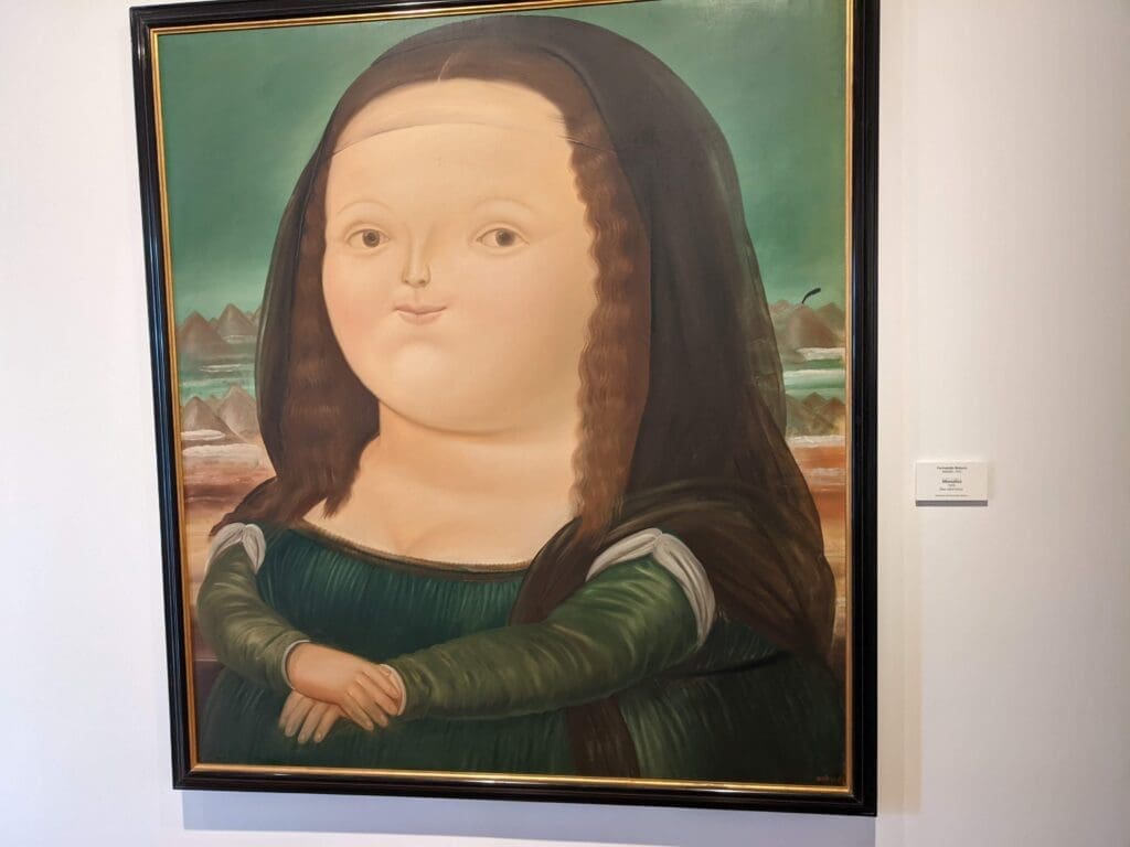 a Botero painting of a woman in a frame in Bogotá, Colombia.