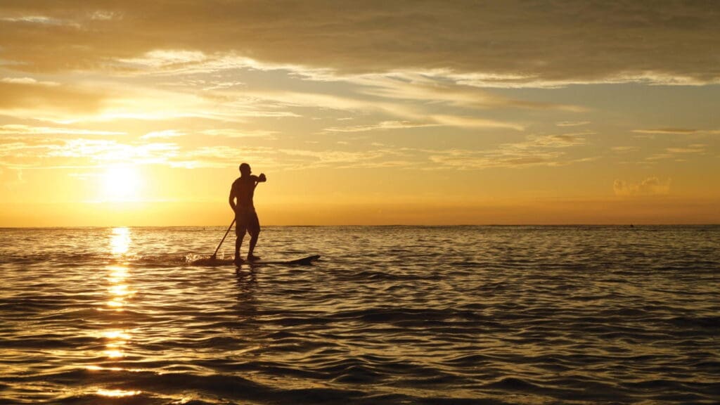 a man on a paddle board