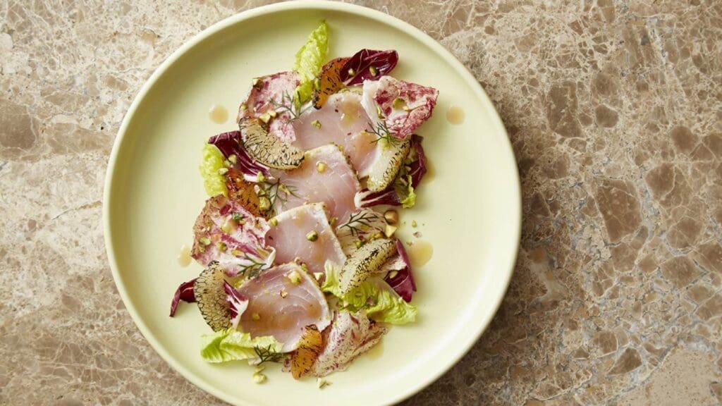 a plate of food on a marble surface
