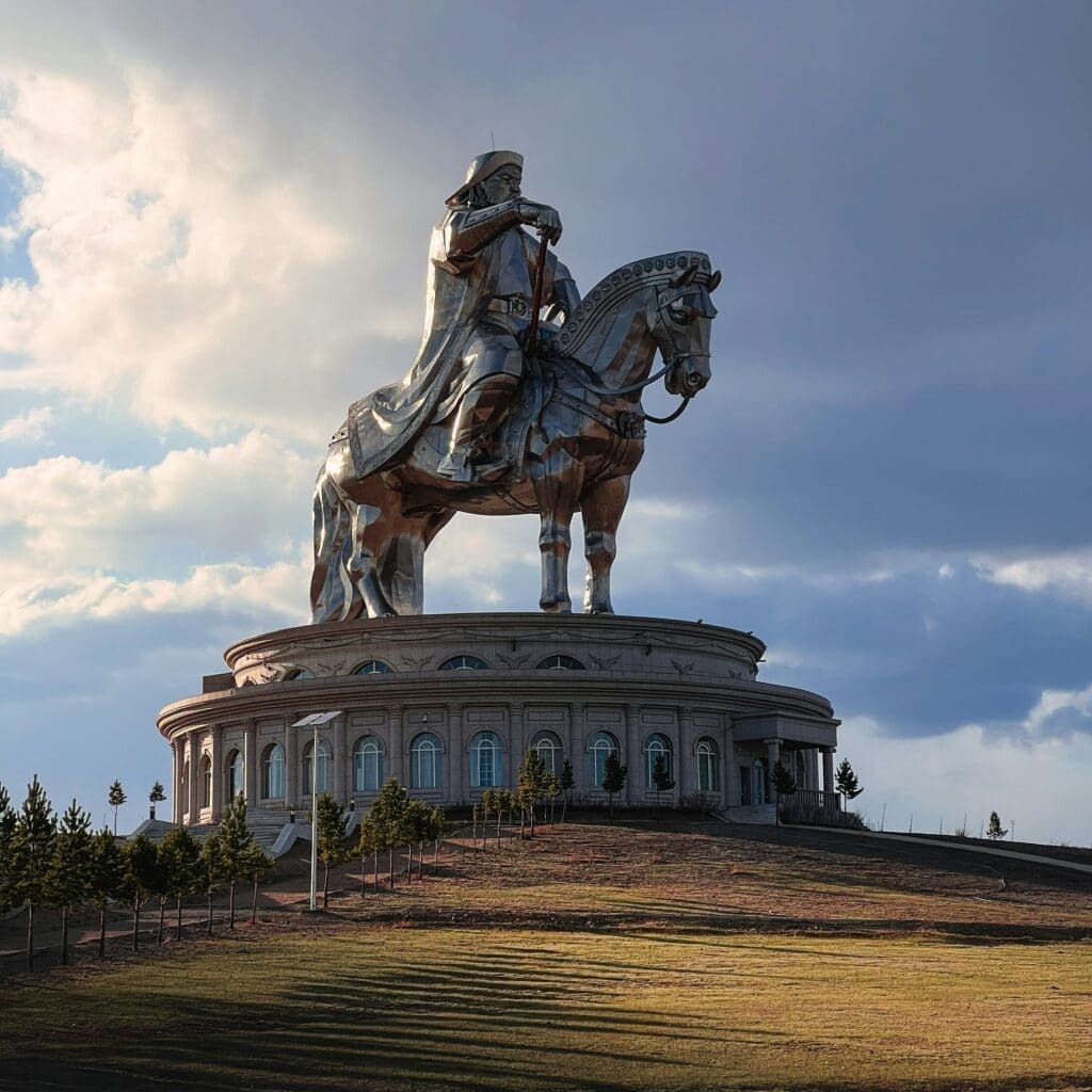a statue of a Ghengis Khan atop Horse