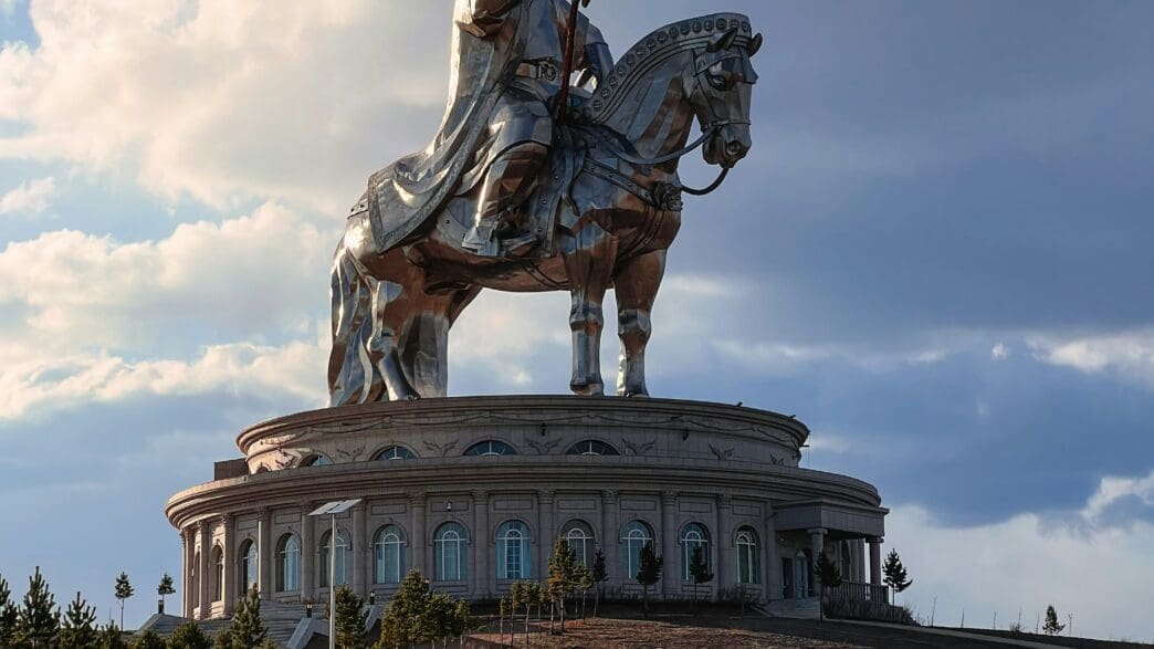 a statue of a Ghengis Khan atop Horse