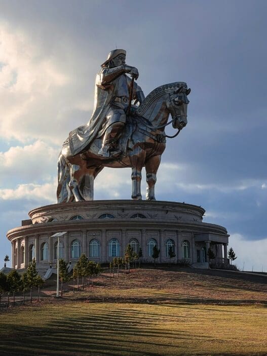 a statue of a Ghengis Khan atop Horse