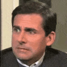 a man looking up with a surprised expression