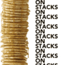 a stack of thin pancakes with syrup on top