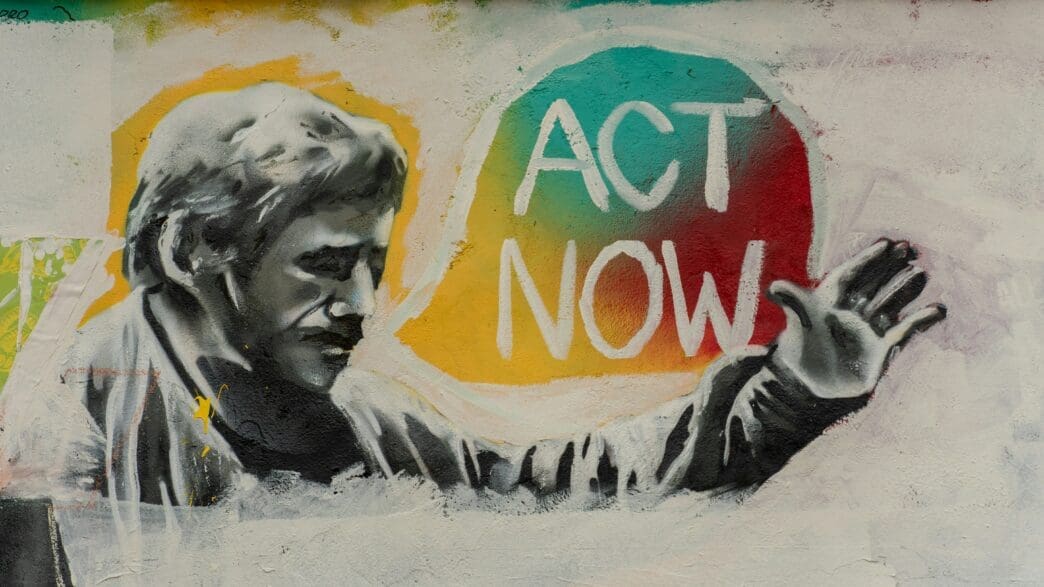 a graffiti of a man pointing at something
