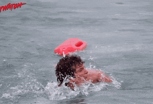 a person swimming in water with a frisbee
