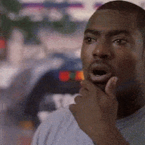 a man with his hand on his mouth