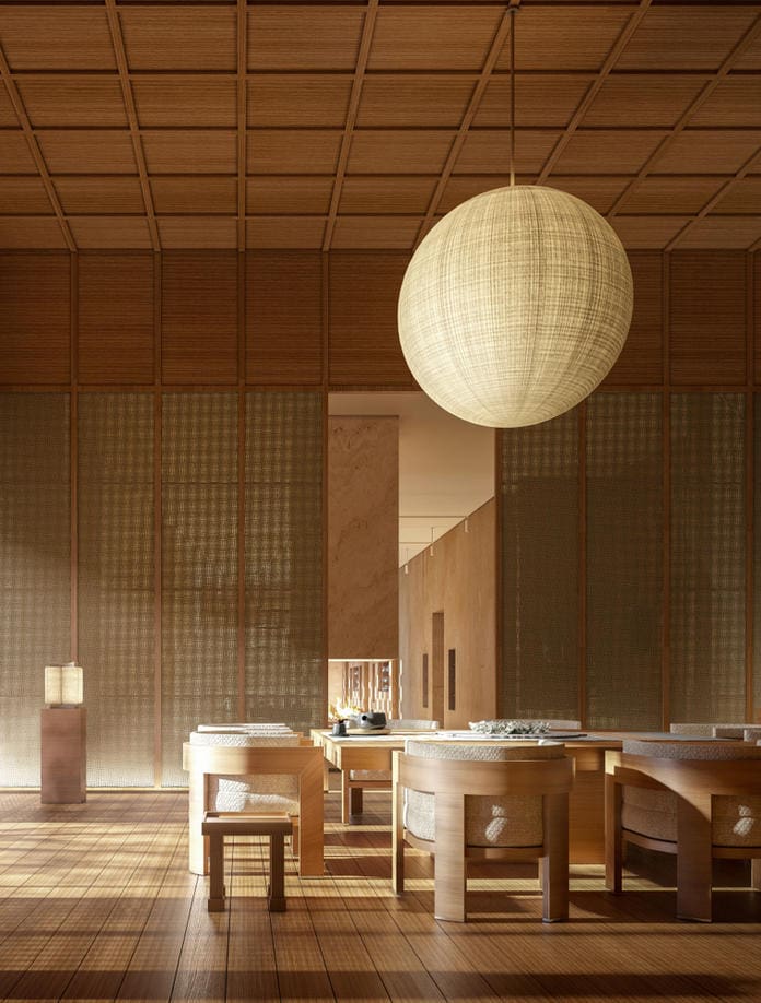 a room with a round light fixture from the ceiling